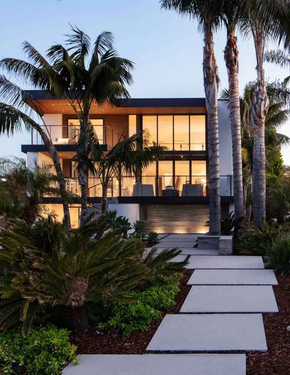 Oceanfront home glowing at twilight on the Santa Barbara coast